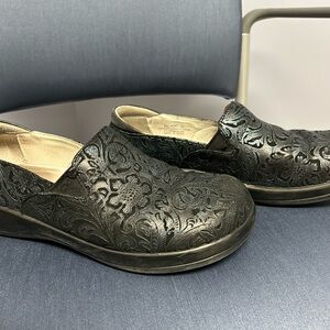 Alegria Black Floral-Embossed Slip-On Clogs